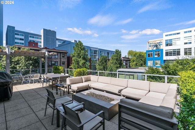 view of patio with a pergola, area for grilling, and an outdoor living space with a fire pit