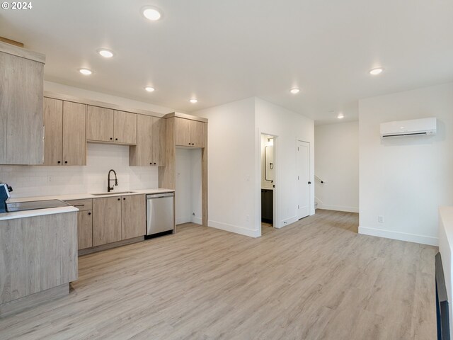 kitchen featuring sink, dishwasher, backsplash, a wall mounted AC, and light brown cabinetry