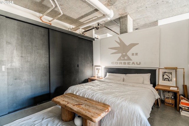 bedroom with concrete flooring