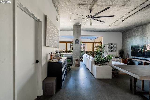 living room with ceiling fan and wine cooler