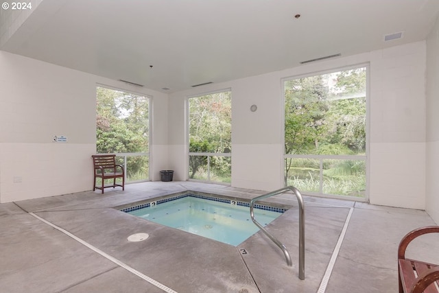 view of swimming pool featuring an indoor in ground hot tub