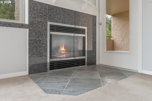 6605 W Burnside Rd Unit 144, Portland, OR 97210 - detailed view of a tile fireplace and baseboards