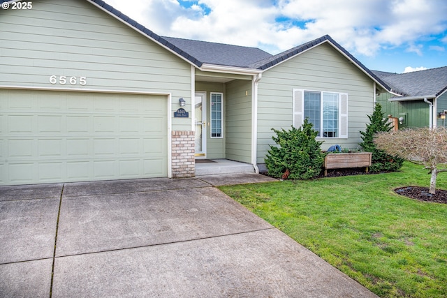 single story home with a garage and a front lawn