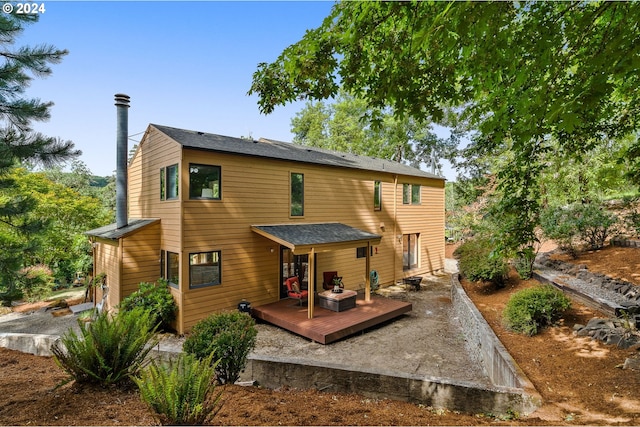 rear view of property with a deck