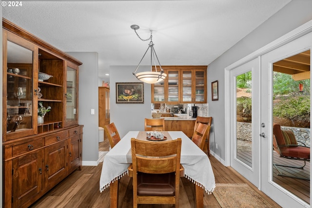 dining room featuring french doors and wood-type flooring