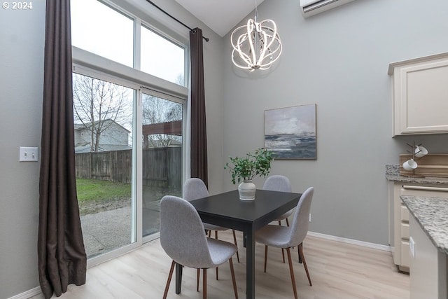 dining area featuring light hardwood / wood-style floors and a notable chandelier