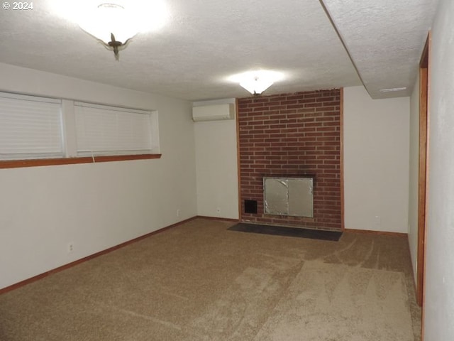 unfurnished living room featuring carpet flooring, a textured ceiling, and a wall unit AC