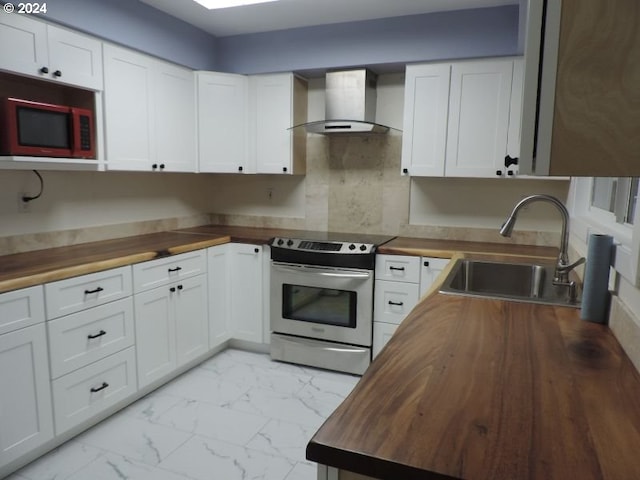 kitchen with white cabinets, stainless steel electric range, and wood counters