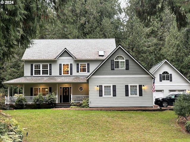 view of front of home with a porch and a front yard