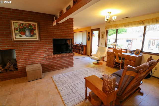 tiled living room featuring an inviting chandelier, brick wall, and a brick fireplace