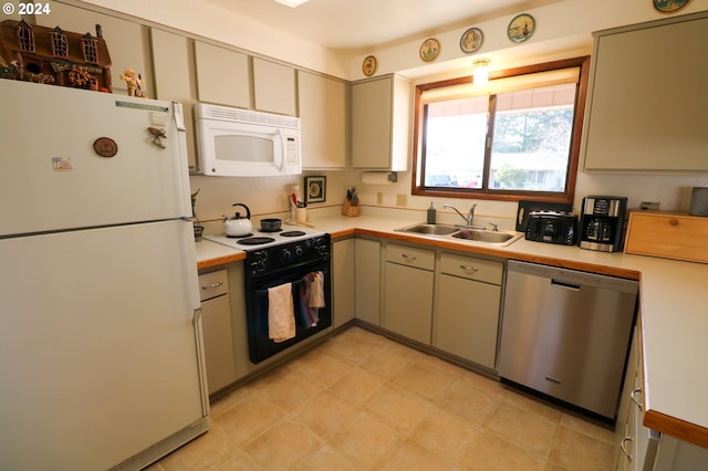 kitchen with white appliances and sink