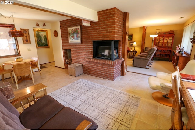 living room with light tile patterned floors and a fireplace