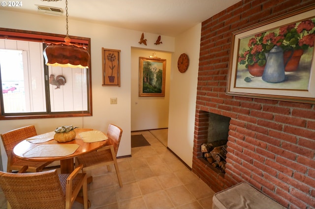 dining area featuring a fireplace