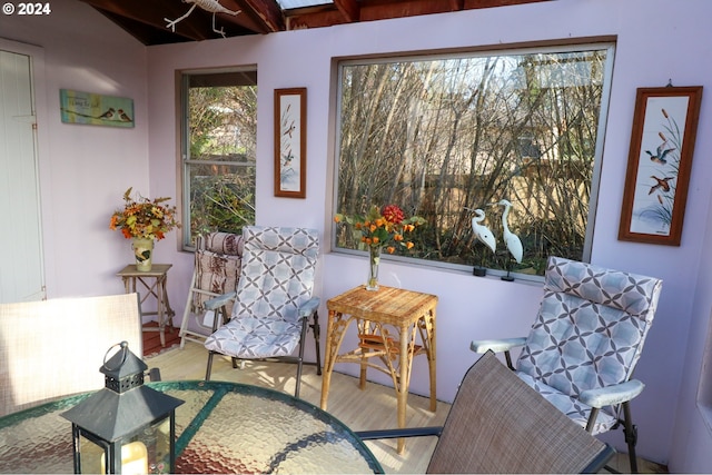 sitting room featuring light hardwood / wood-style flooring and beamed ceiling