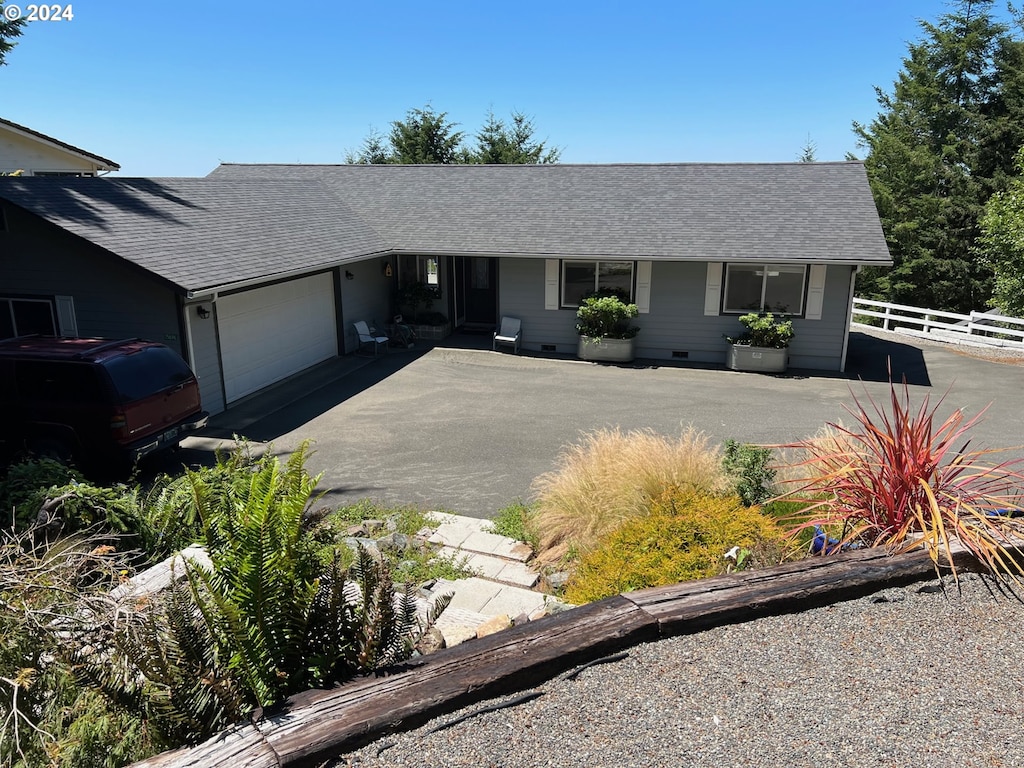 ranch-style house featuring a garage