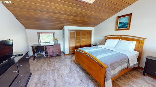 bedroom with a closet, wooden ceiling, lofted ceiling, and light wood-type flooring