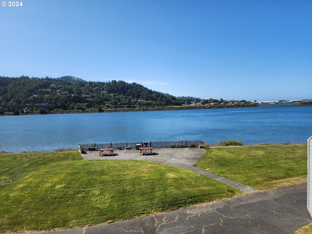 property view of water with a fire pit