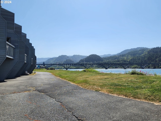 view of street with a water and mountain view