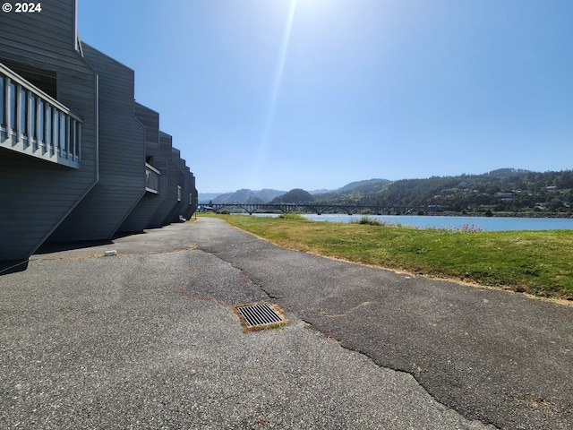 view of street featuring a water and mountain view