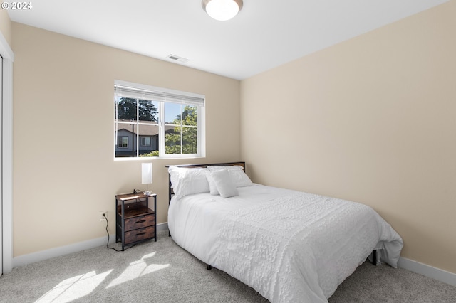 bedroom with light carpet