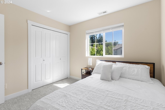 carpeted bedroom with a closet