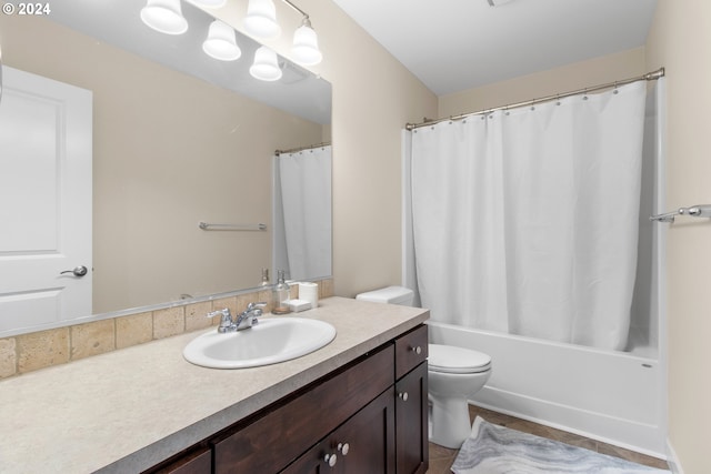 full bathroom with vanity, toilet, and shower / tub combo