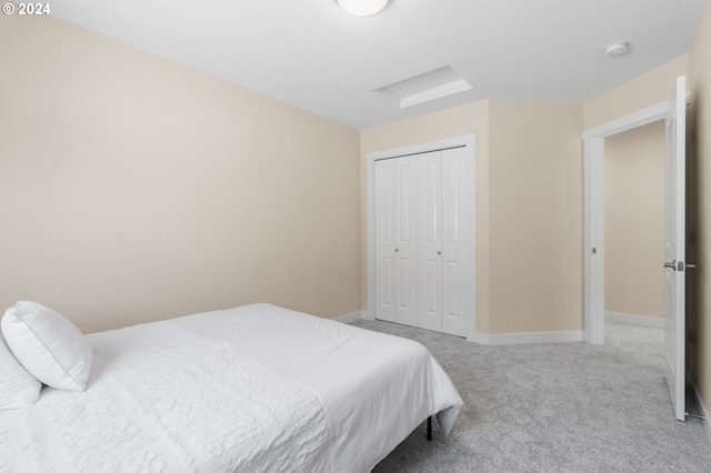 carpeted bedroom featuring a closet