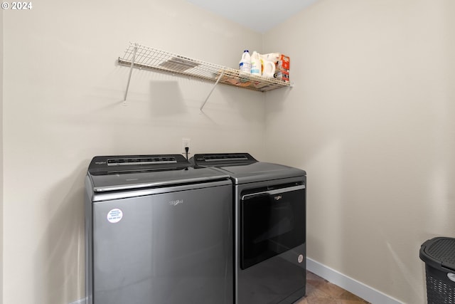 washroom with separate washer and dryer