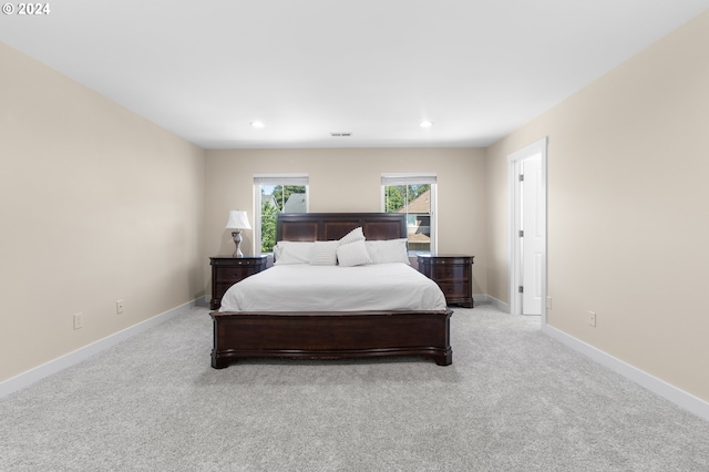 bedroom with light carpet