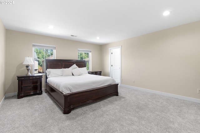 bedroom featuring light carpet