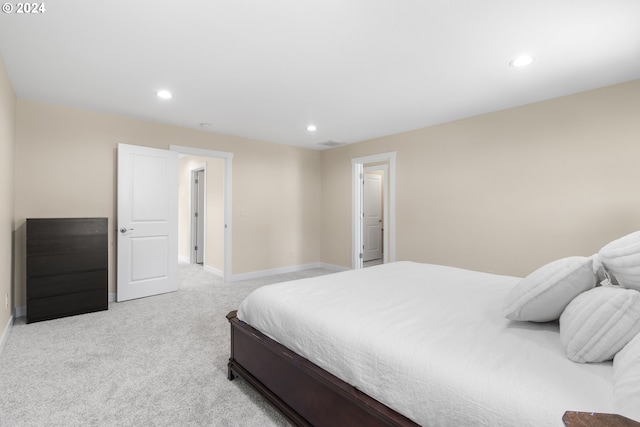 bedroom featuring light colored carpet