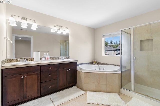 bathroom featuring tile patterned floors, vanity, and independent shower and bath