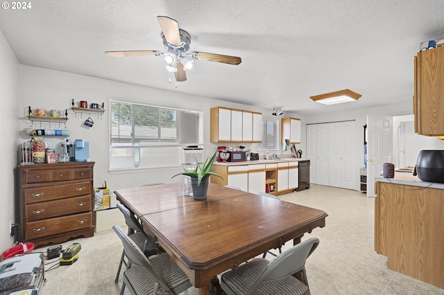 dining room with a textured ceiling and ceiling fan