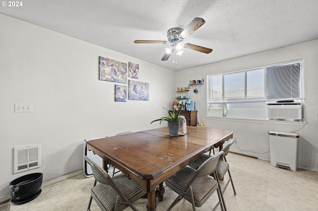 dining area featuring a textured ceiling, ceiling fan, and cooling unit