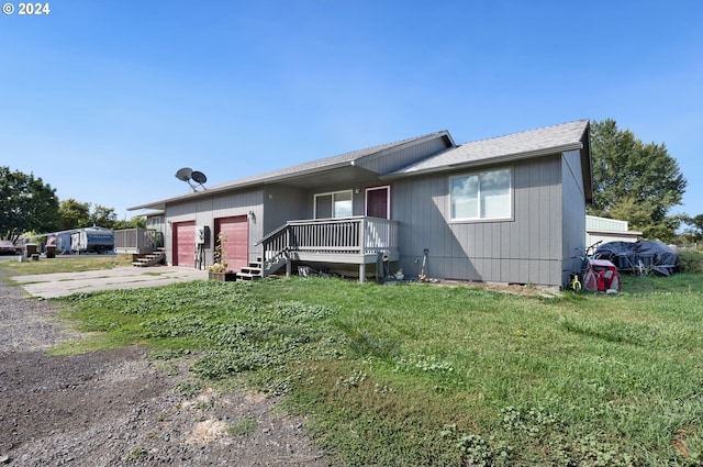 view of front of home with a garage and a front yard