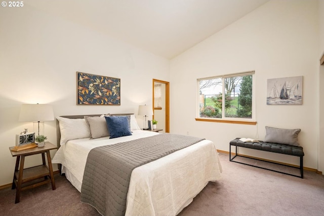 bedroom with baseboards, carpet floors, and high vaulted ceiling