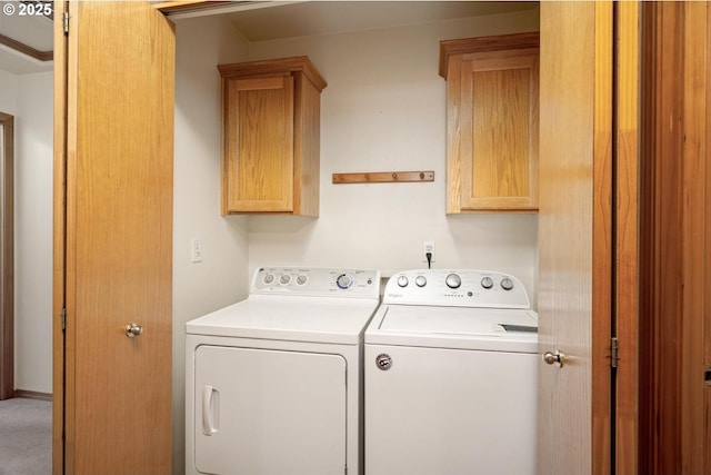 laundry room with cabinet space and independent washer and dryer