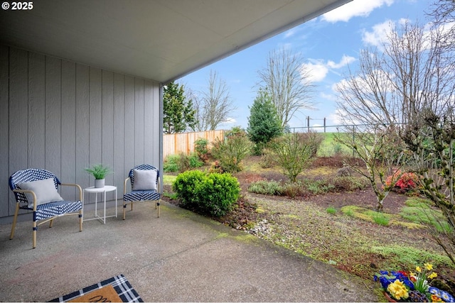 view of patio / terrace featuring fence