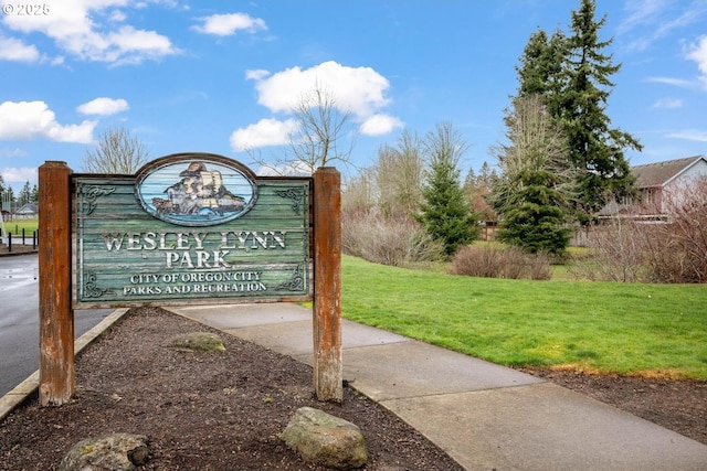 view of property's community with a lawn