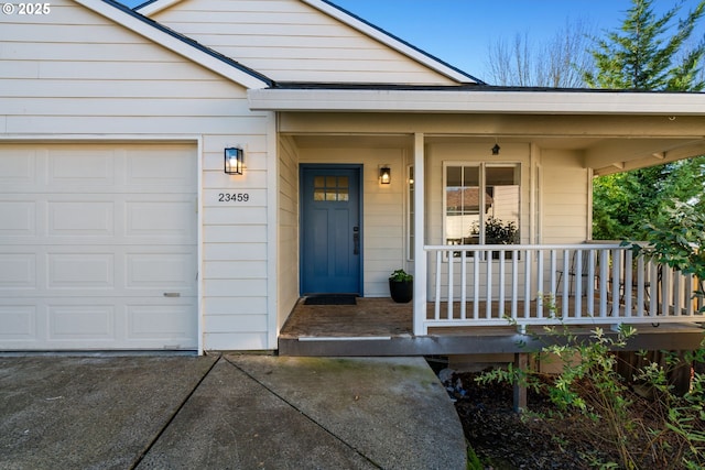 property entrance featuring a garage and a porch