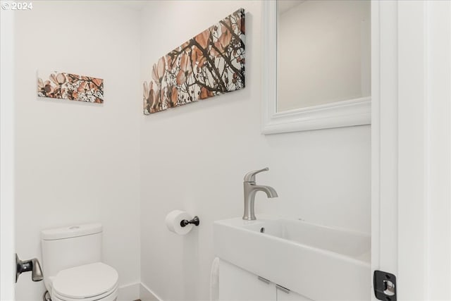 bathroom featuring sink and toilet