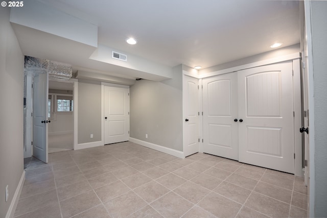 interior space with visible vents, recessed lighting, a closet, light tile patterned floors, and baseboards