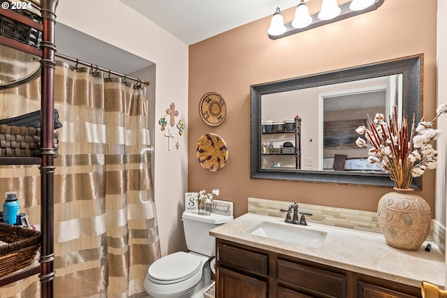 bathroom with walk in shower, vanity, and toilet