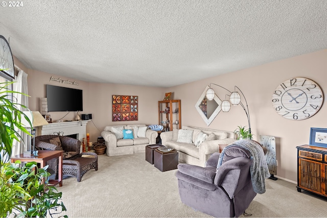 carpeted living room with a textured ceiling and a brick fireplace