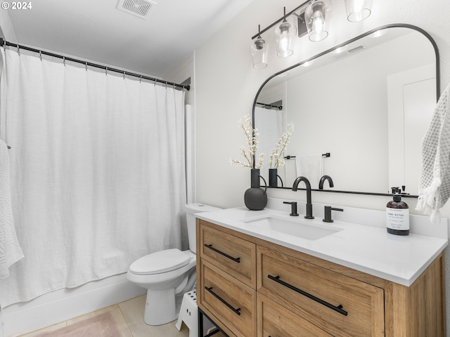 full bathroom with vanity, toilet, tile patterned flooring, and shower / tub combo with curtain