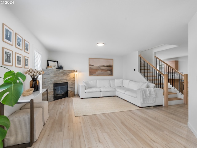 living room with a fireplace and light hardwood / wood-style floors