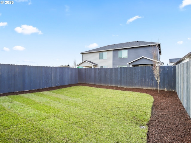 view of yard featuring a fenced backyard