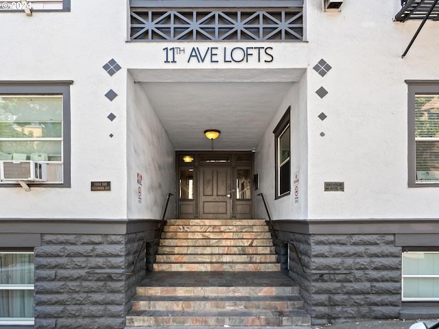 1104 SW Columbia St Unit 105, Portland, OR 97201 - entrance to property with stucco siding and cooling unit