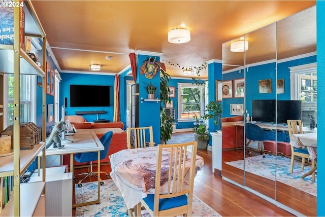 interior space with crown molding and hardwood / wood-style floors