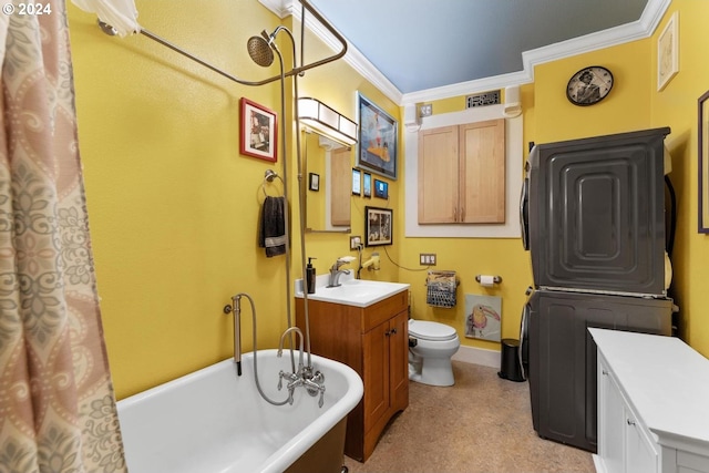 bathroom featuring toilet, vanity, ornamental molding, and a bath